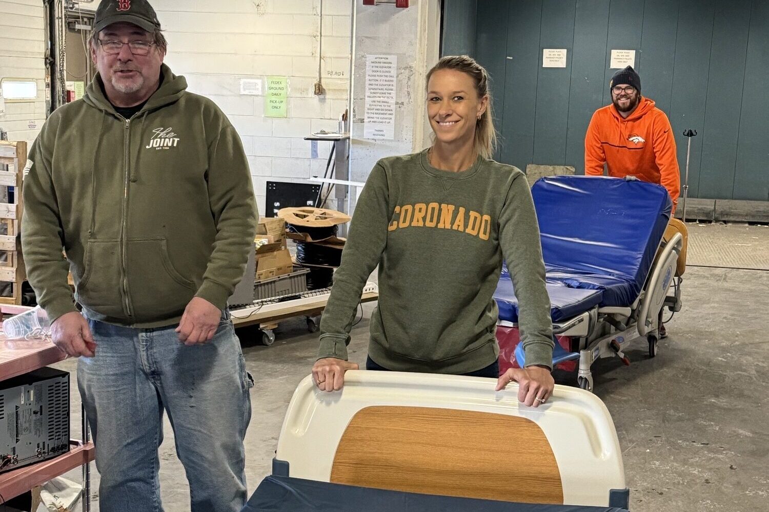 Project C.U.R.E. volunteers removing donated medical equipment and medical beds from Lutheran Medical Center