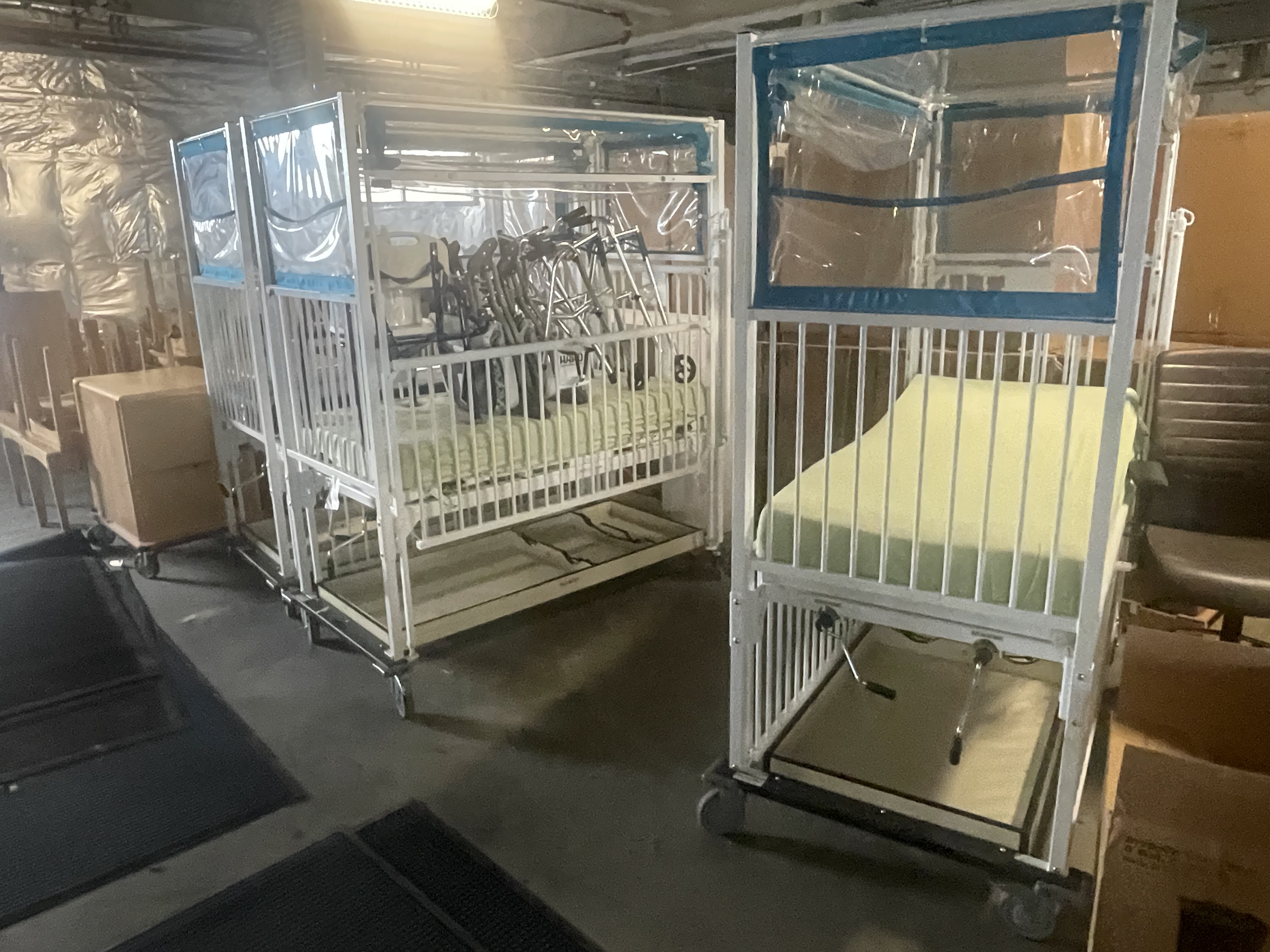 Three cribs lined up next to one another in the Lutheran Medical Center, ready to be picked up by Project C.U.R.E. volunteers. 