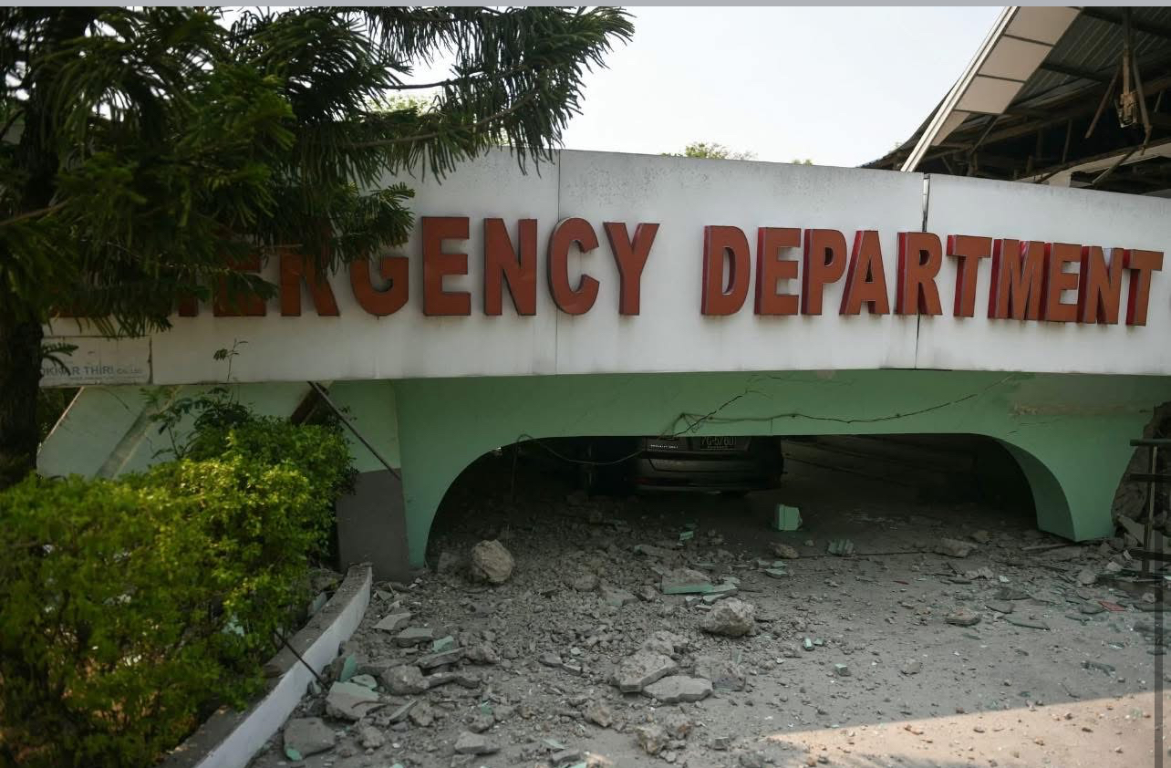 Collapsed emergency department entrance at a hospital in Myanmar following the 2025 earthquake, showing extensive damage to healthcare infrastructure and the urgent need for relief aid.