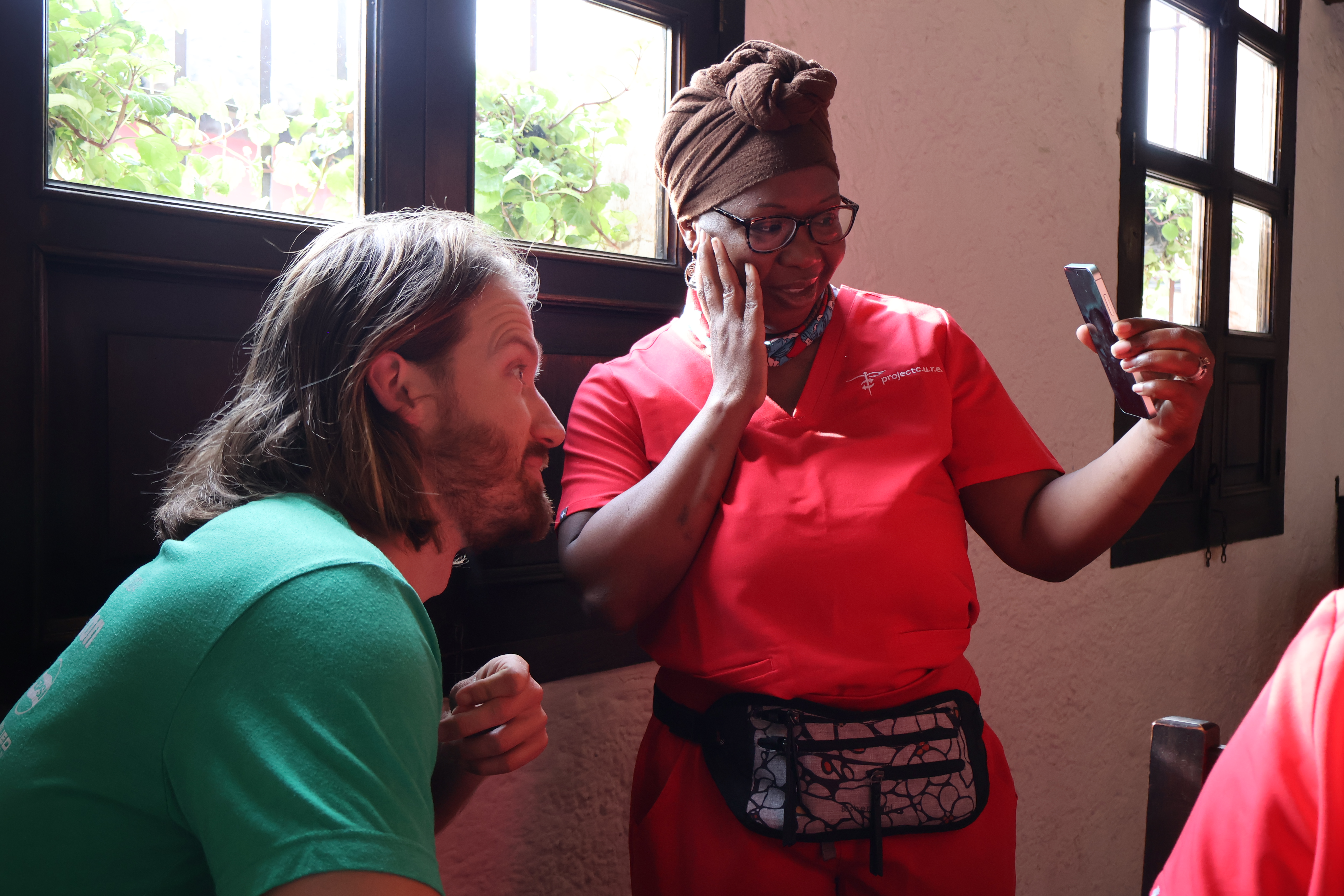 Doctor on a video call with her young children before starting a clinic day in rural Guatemala during a volunteer medical mission.