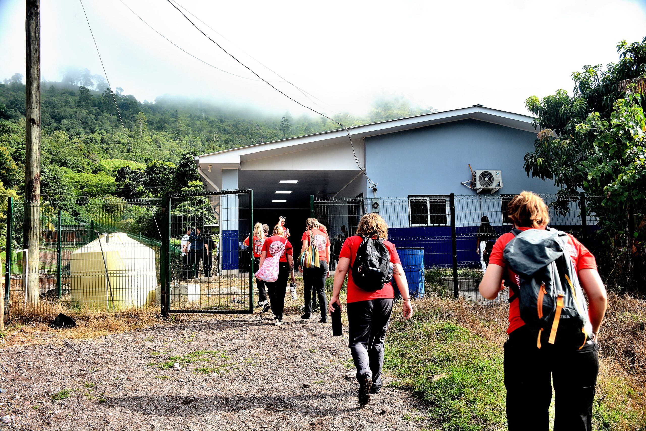 Project C.U.R.E., Rose Medical Center team walking into international clinic in Honduras
