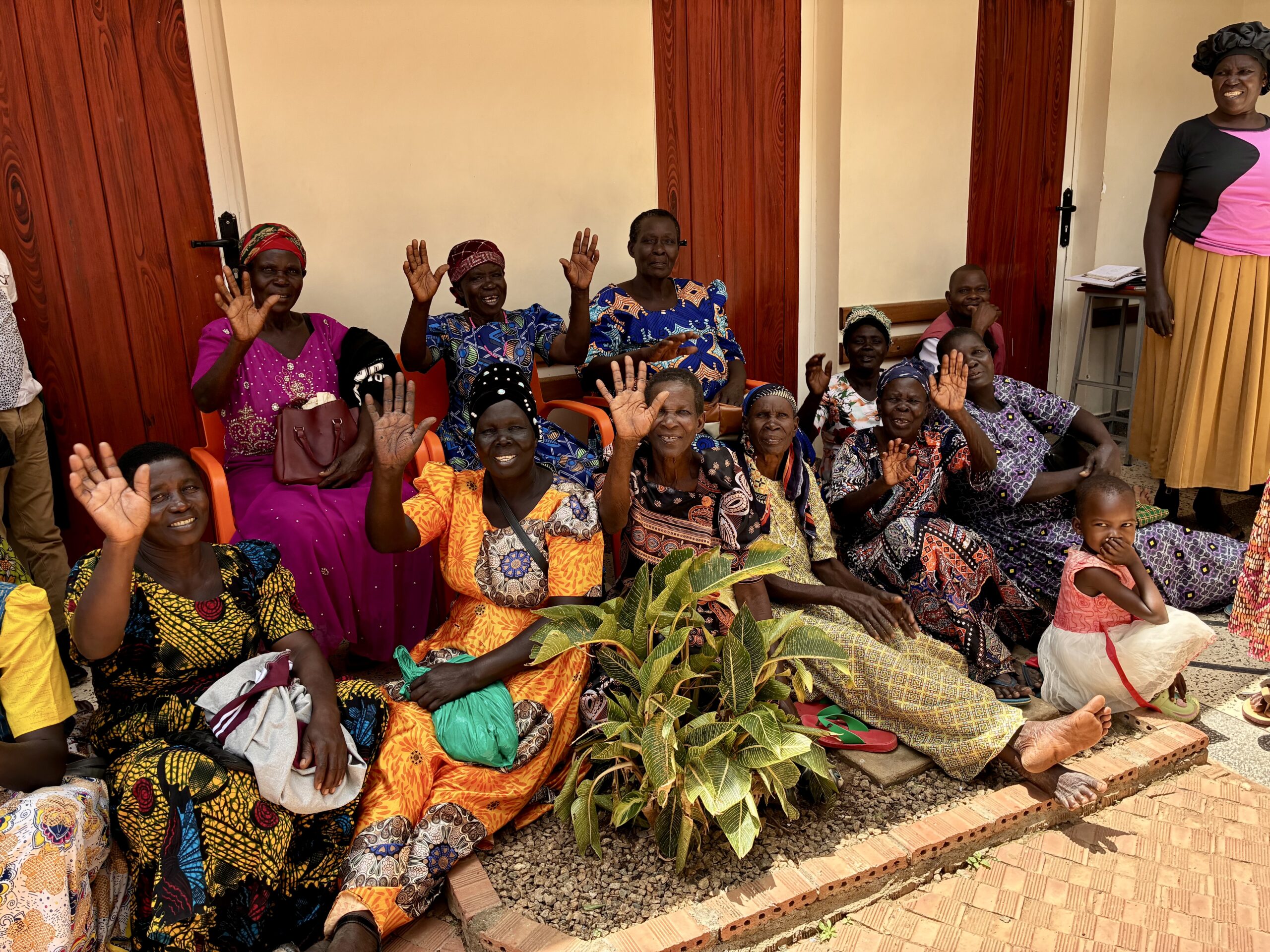 Women at Atutur Hospital in Uganda greeting Project C.U.R.E. needs assessor.