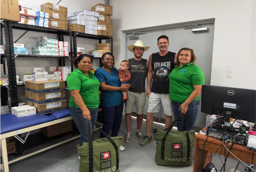 Group of Project C.U.R.E. volunteers with local medical staff in Honduras delivering C.U.R.E. Kits.