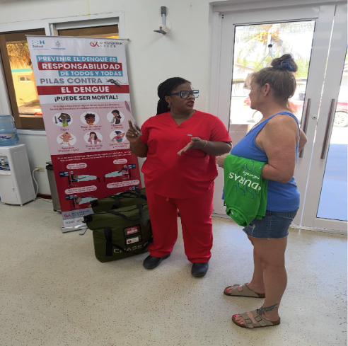 Krissy Callahan Talking to a Physician at a Clinic in Flowers Bay
