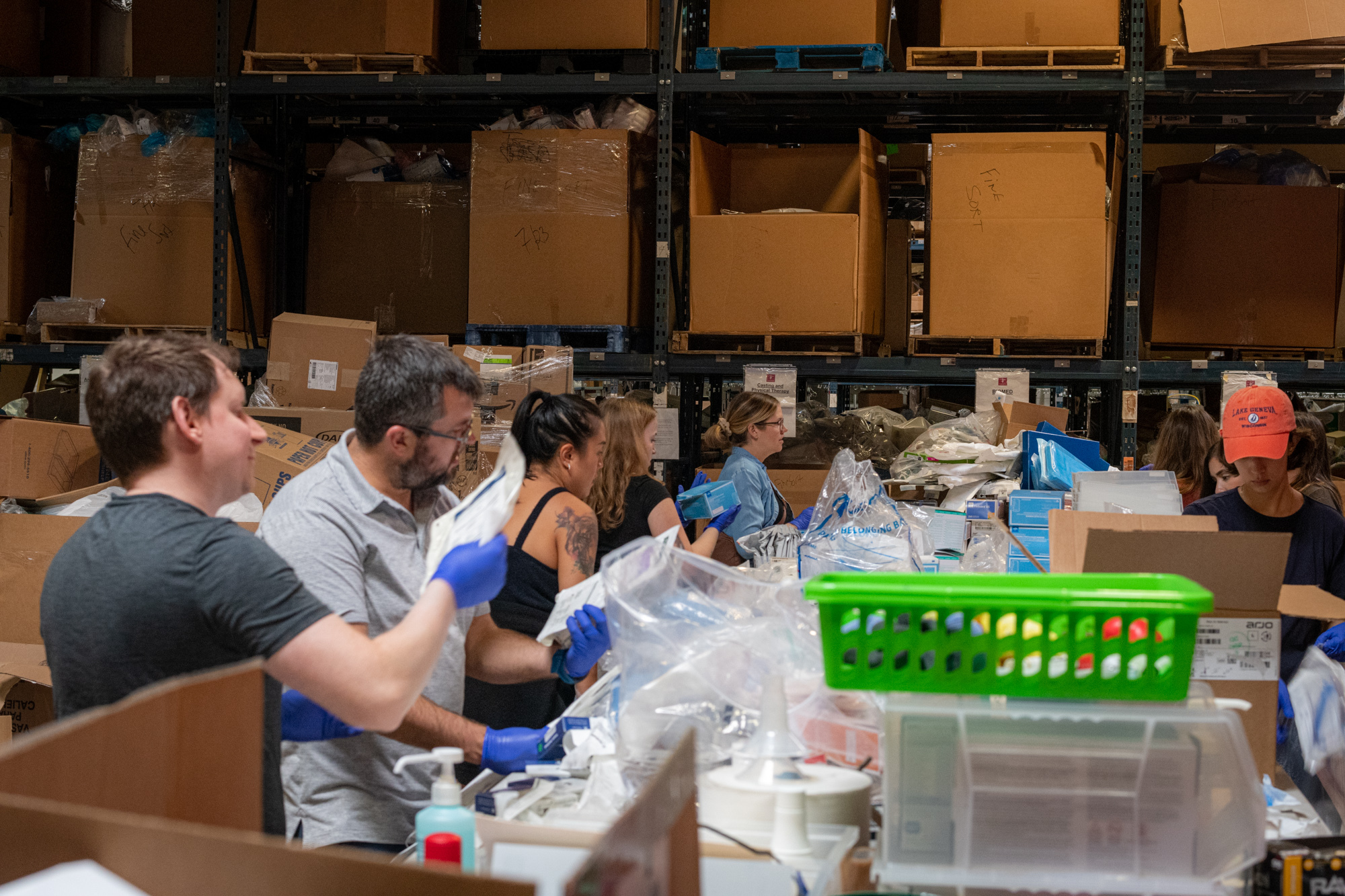 Volunteers sorting medical supplies at the Chicago Project C.U.R.E. warehouse